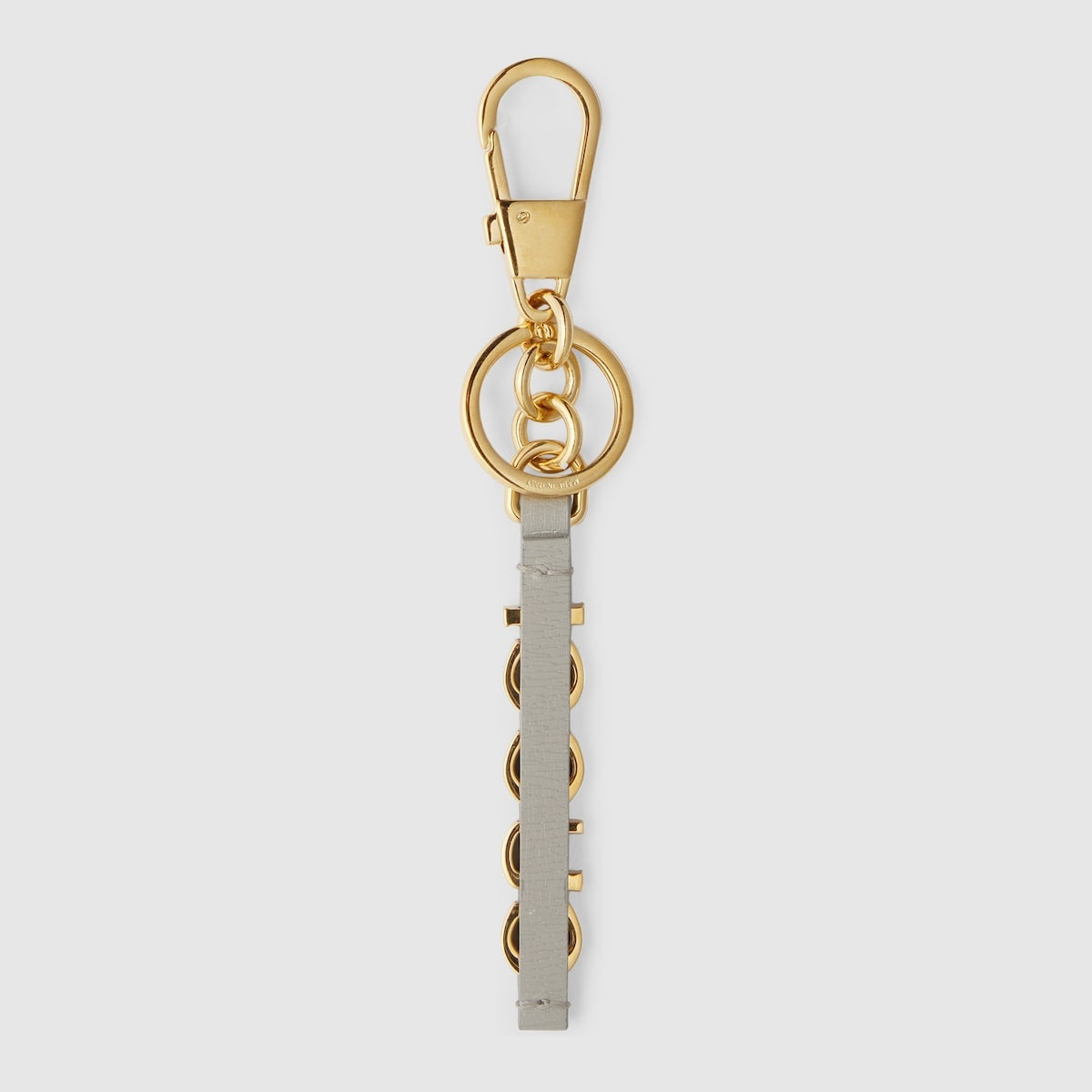 New Gucci Keychain with Gucci script in gold-toned brass
